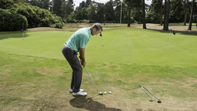 a-golfer-chipping-onto-a-green